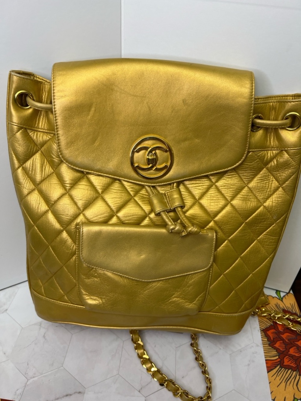 Vintage CHANEL Metallic Gold Quilted Leather Drawstring Backpack
